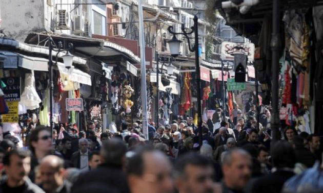 Turkish people throng a street of the Mahmutpasa marketplace in Istanbul recently (AFP photo)